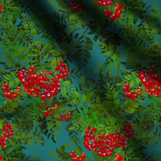 pattern of red rowan berries and green leaves on turquoise background