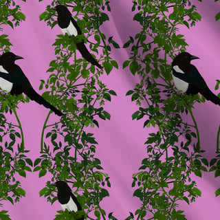 pattern of 2 magpies on green background with pale blue background shown as fabric
